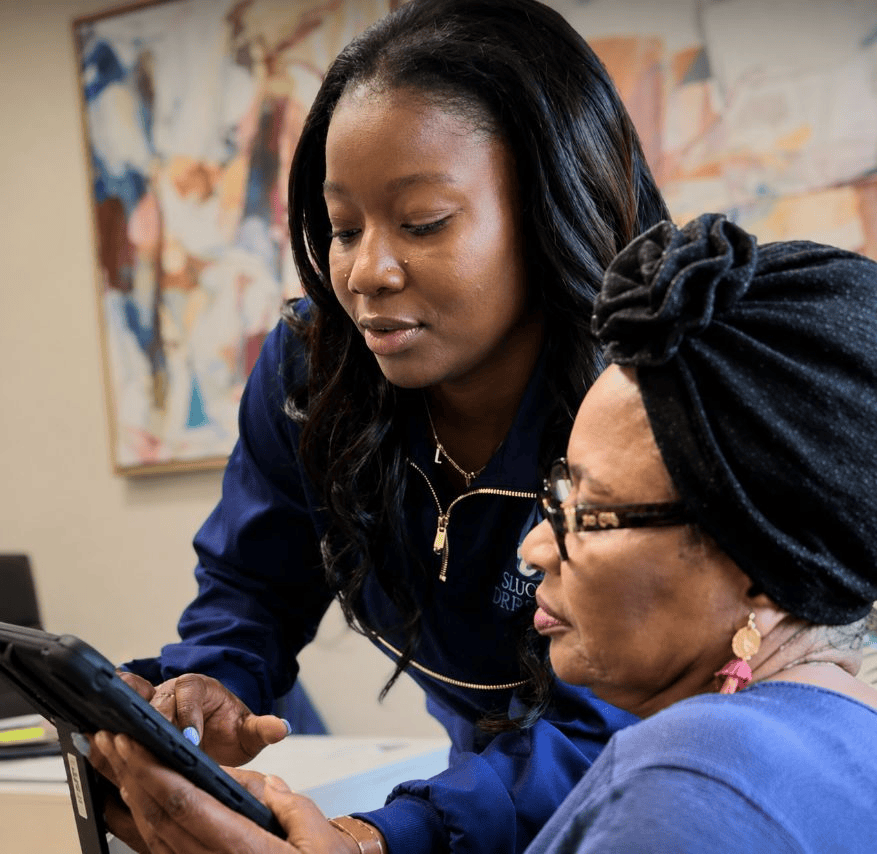 Lola Peterson, MPH, PA-C consulting with a client